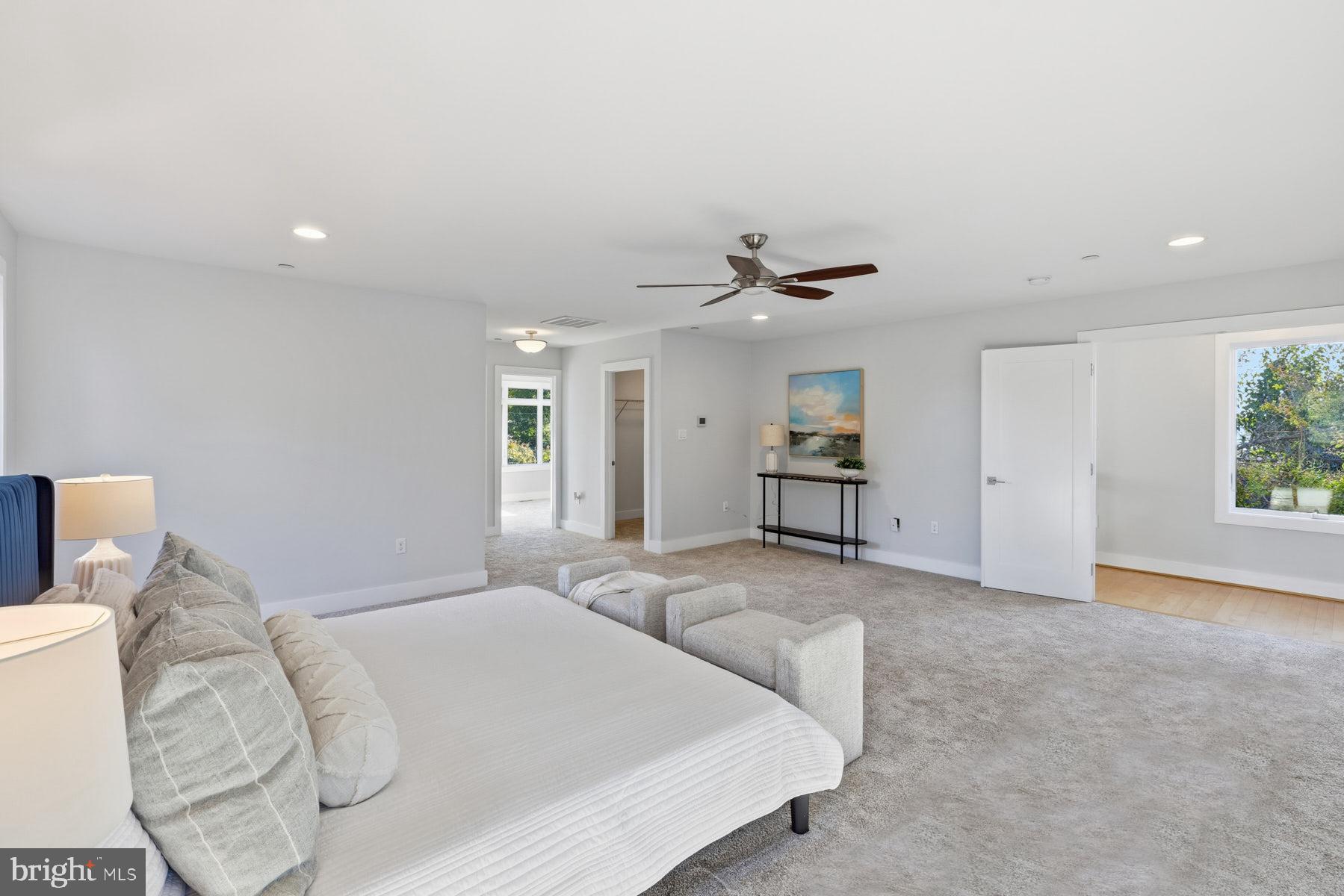 34 Johnson Road Pasadena, MD 21122 - Photo 22 of 45 a spacious bedroom with a bed and a chandelier