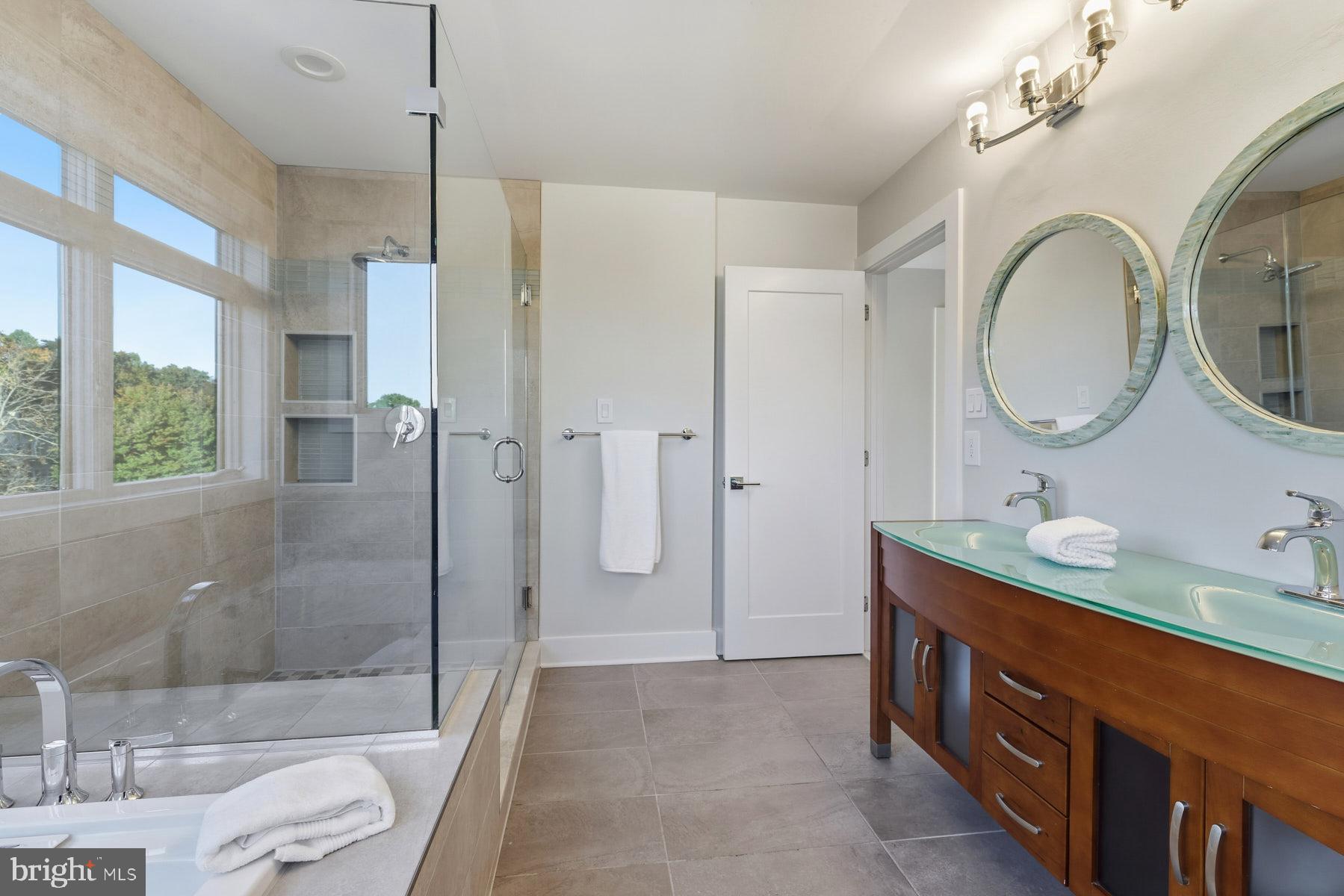 34 Johnson Road Pasadena, MD 21122 - Photo 24 of 45 a spacious bathroom with a granite countertop sink mirror toilet and shower