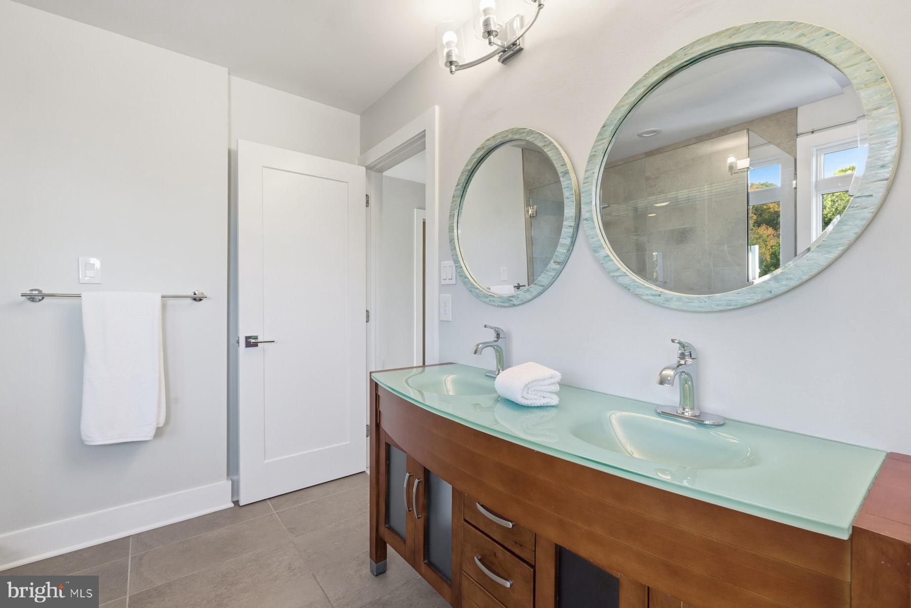 34 Johnson Road Pasadena, MD 21122 - Photo 25 of 45 a bathroom with a sink and a mirror