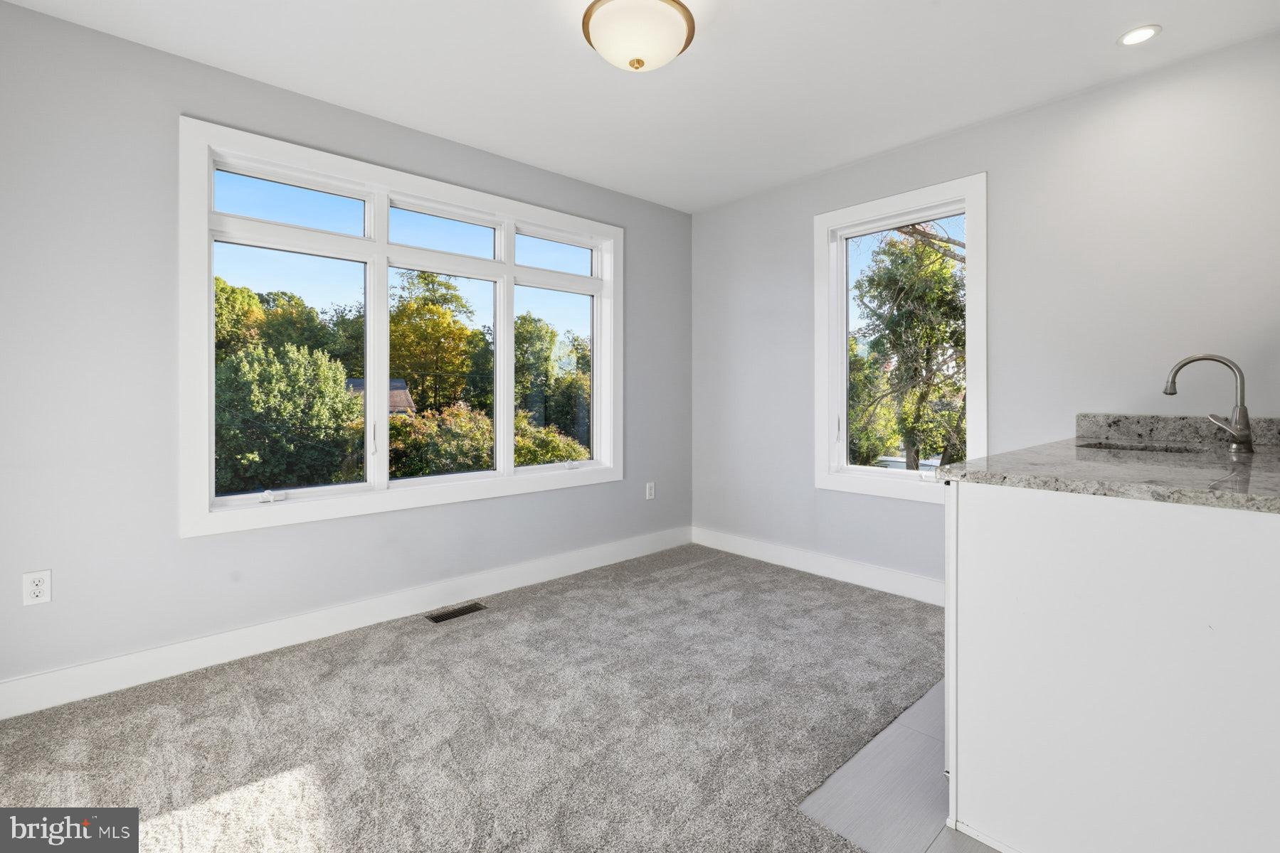 34 Johnson Road Pasadena, MD 21122 - Photo 27 of 45 a bathroom with a granite countertop sink and a window