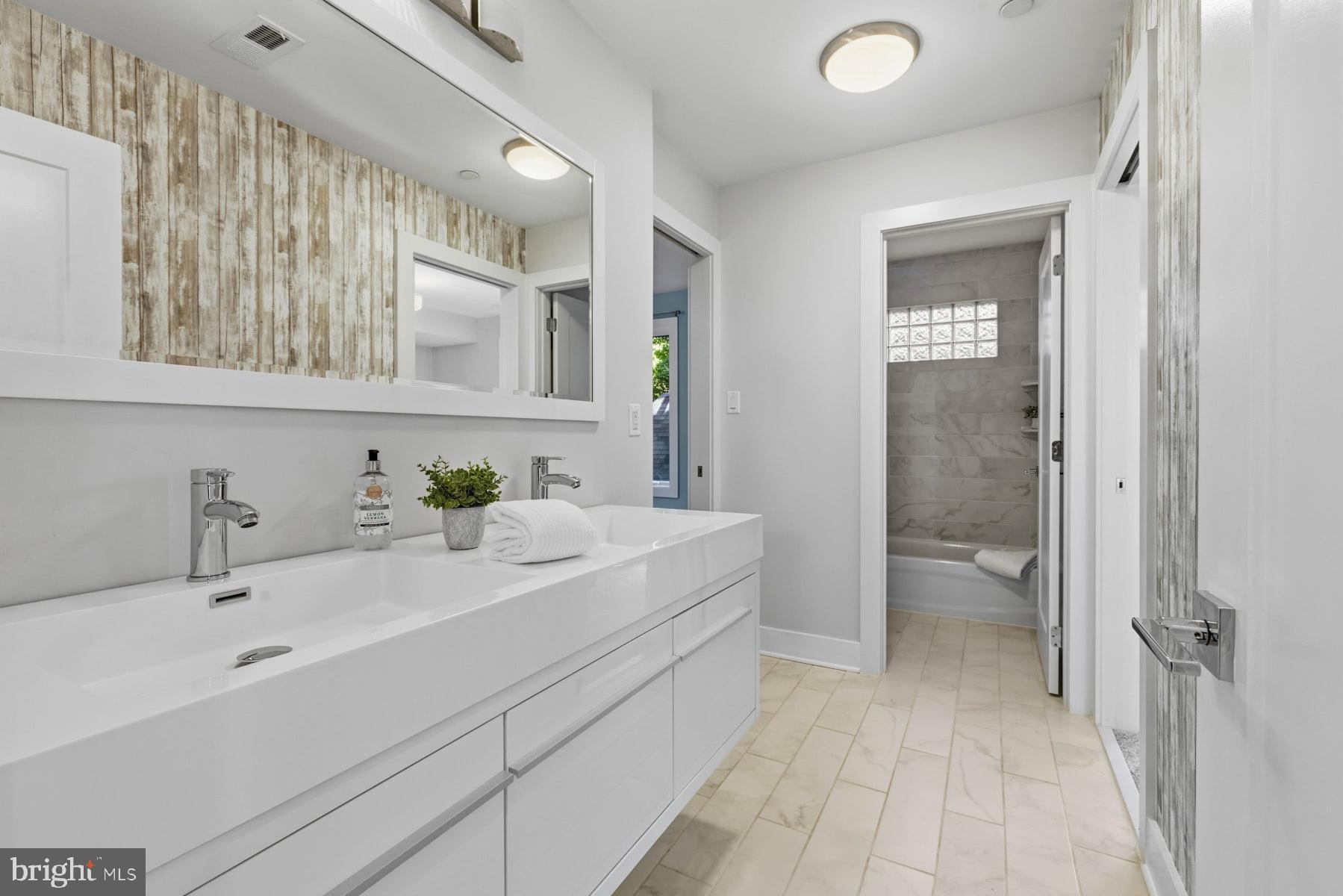 34 Johnson Road Pasadena, MD 21122 - Photo 31 of 45 a spacious bathroom with a double vanity sink mirror and double