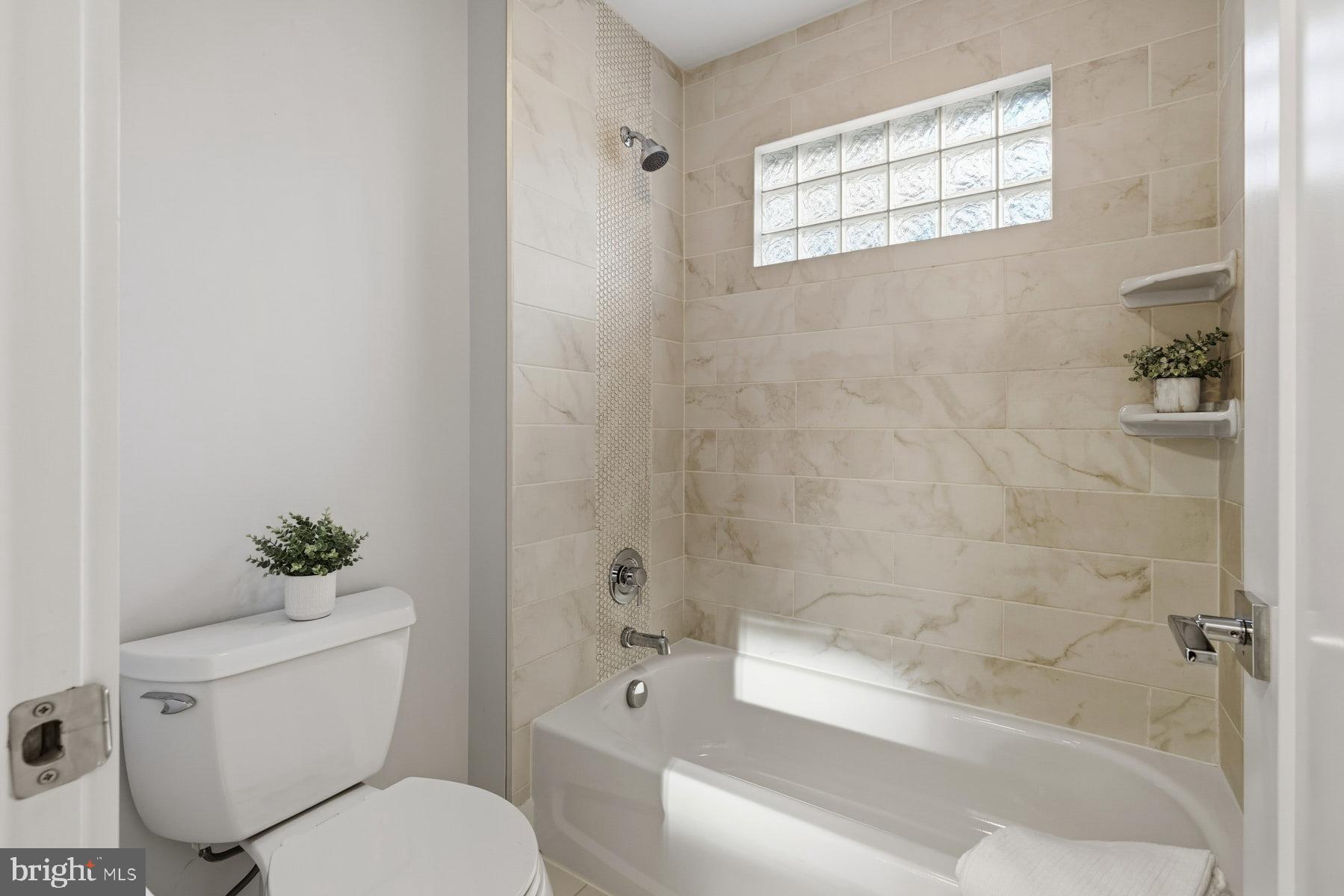 34 Johnson Road Pasadena, MD 21122 - Photo 32 of 45 a bathroom with a toilet and a shower