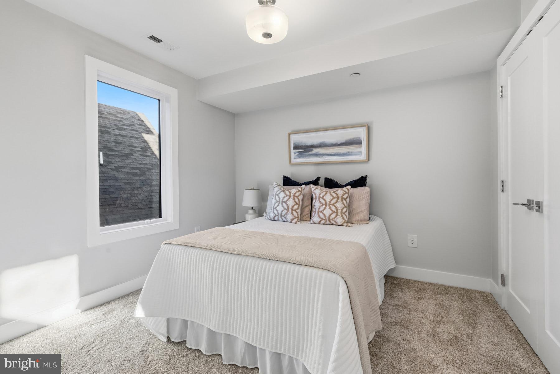 34 Johnson Road Pasadena, MD 21122 - Photo 33 of 45 a bedroom with a bed and a window