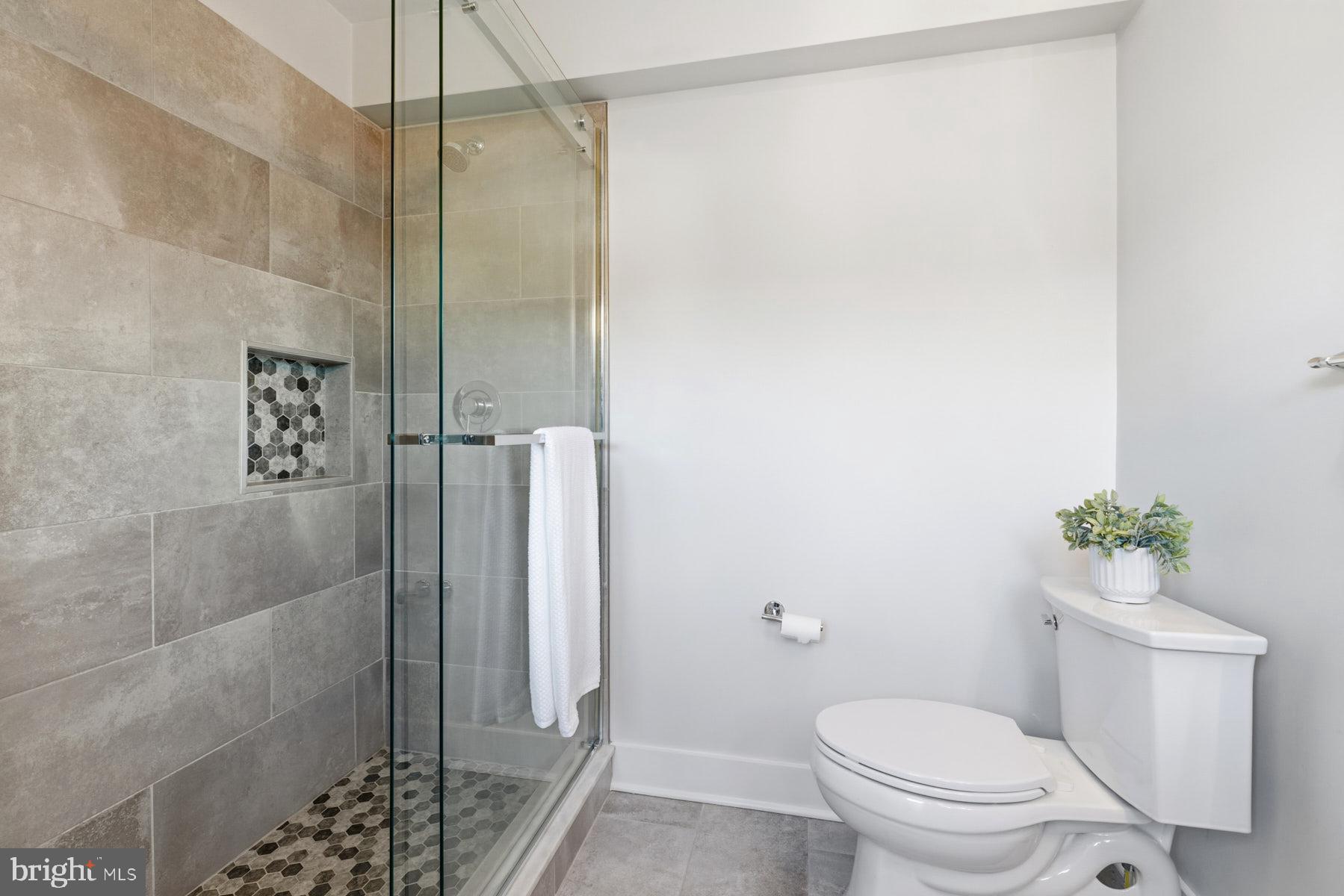 34 Johnson Road Pasadena, MD 21122 - Photo 36 of 45 a bathroom with a shower and a toilet