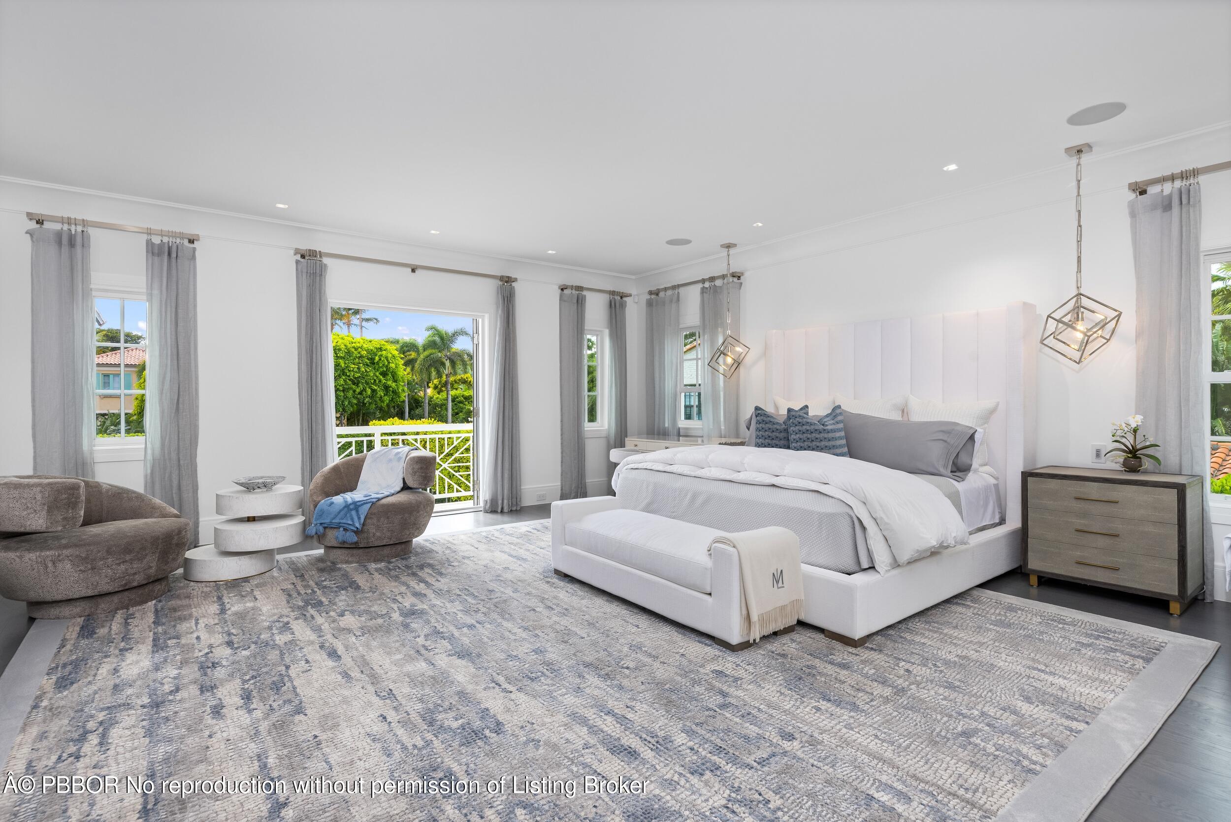201 Banyan Road Palm Beach, FL 33480 - Photo 17 of 42 a spacious bedroom with a bed and glass windows