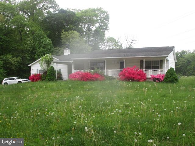 551 Post Road Rising Sun, MD 21911 - Photo 1 of 6 a view of a backyard with potted plants and large tree