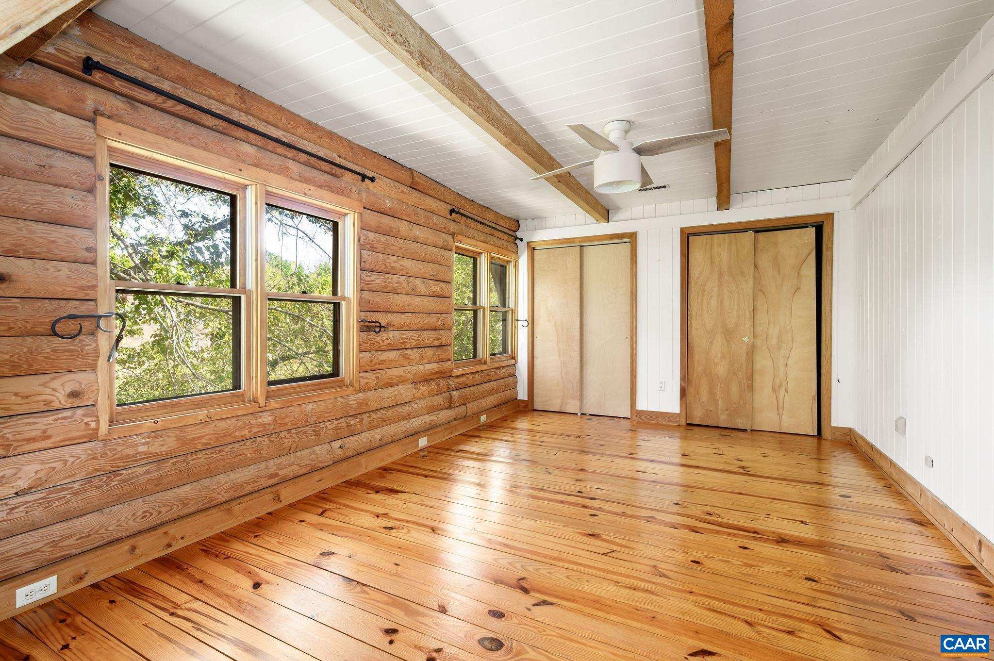 3946 Rock Branch Road North Garden, VA 22959 - Photo 20 of 36 a view of an empty room with wooden floor and a window