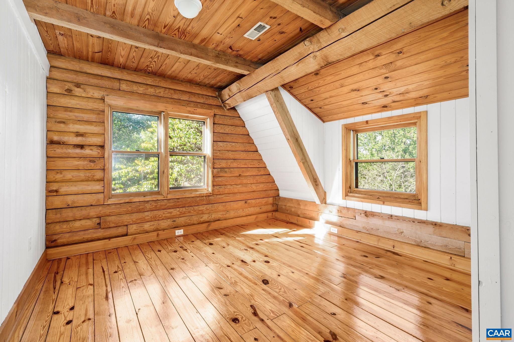 3946 Rock Branch Road North Garden, VA 22959 - Photo 23 of 36 a view of an empty room with wooden floor and a window