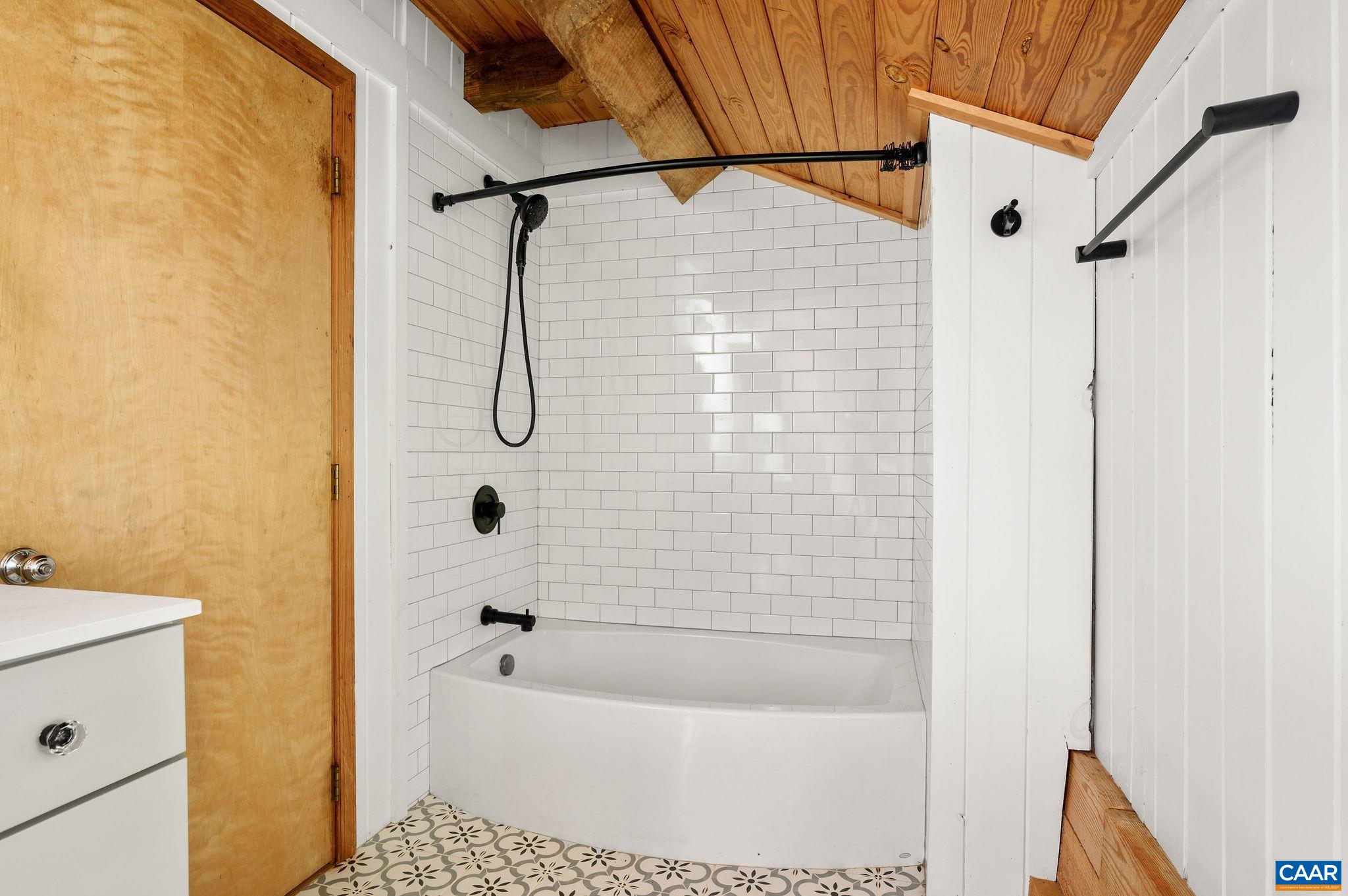 3946 Rock Branch Road North Garden, VA 22959 - Photo 26 of 36 a bathroom with a bathtub and a shower