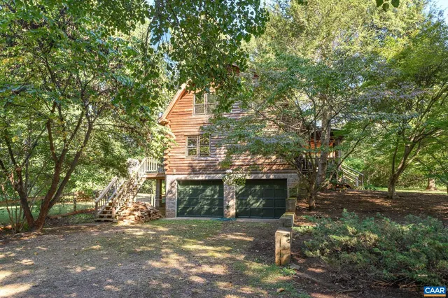 front view of a house with a tree