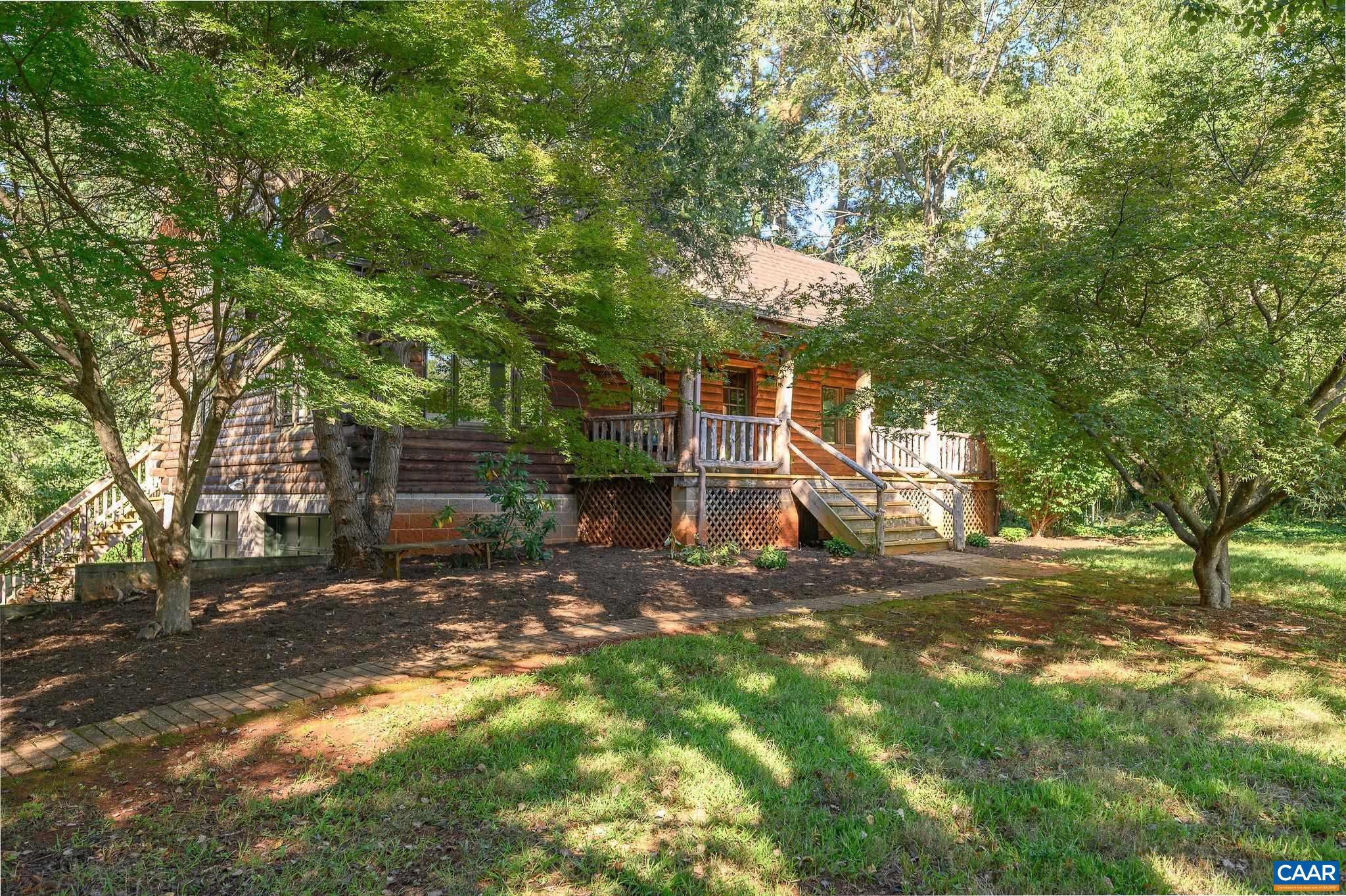 3946 Rock Branch Road North Garden, VA 22959 - Photo 5 of 36 a view of a yard with plants and large trees