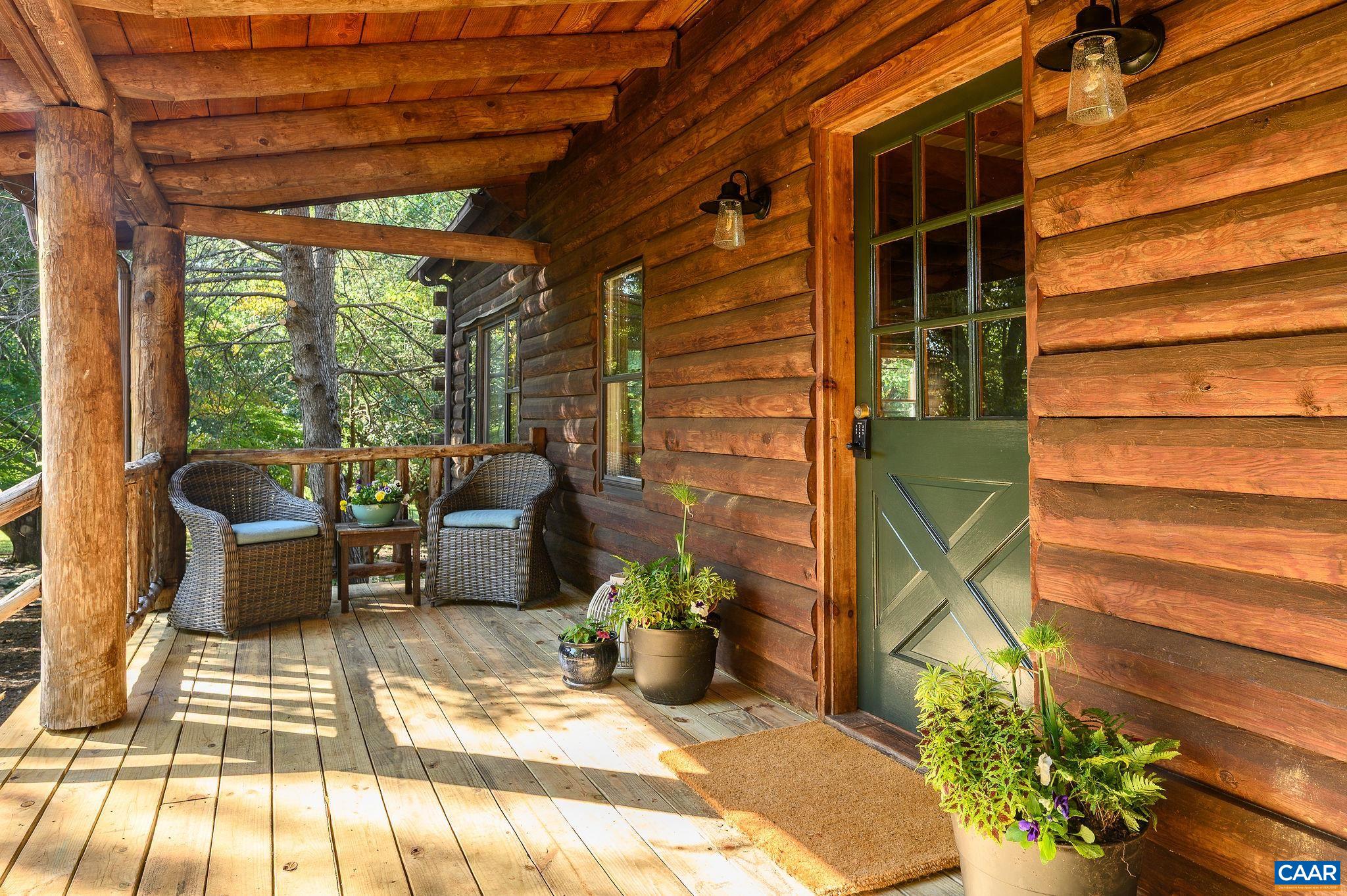3946 Rock Branch Road North Garden, VA 22959 - Photo 6 of 36 a view of a patio with couches and potted plants