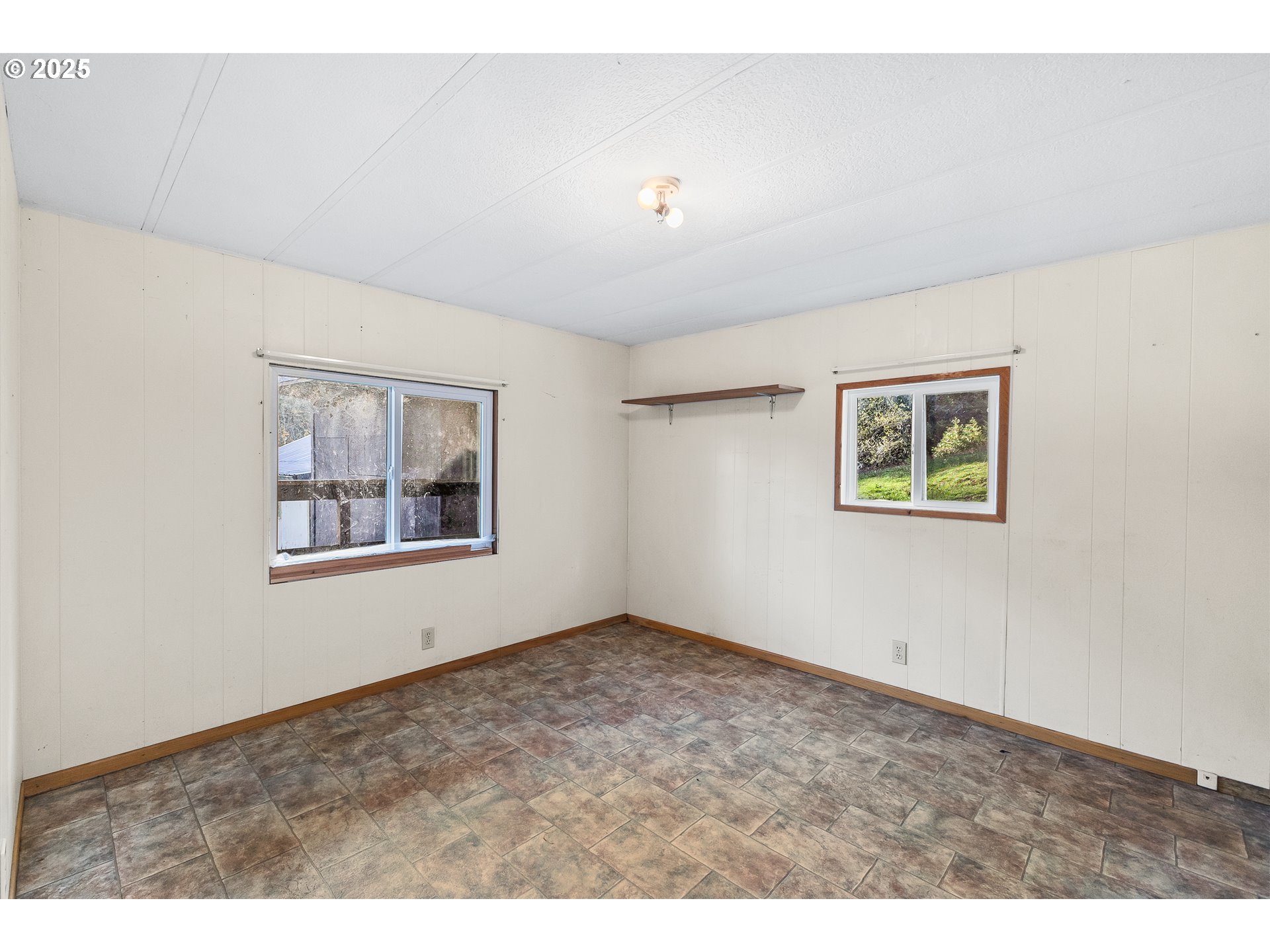 15779 Highway 42 Myrtle Point, OR 97458 - Photo 16 of 33 a view of an empty room with a window