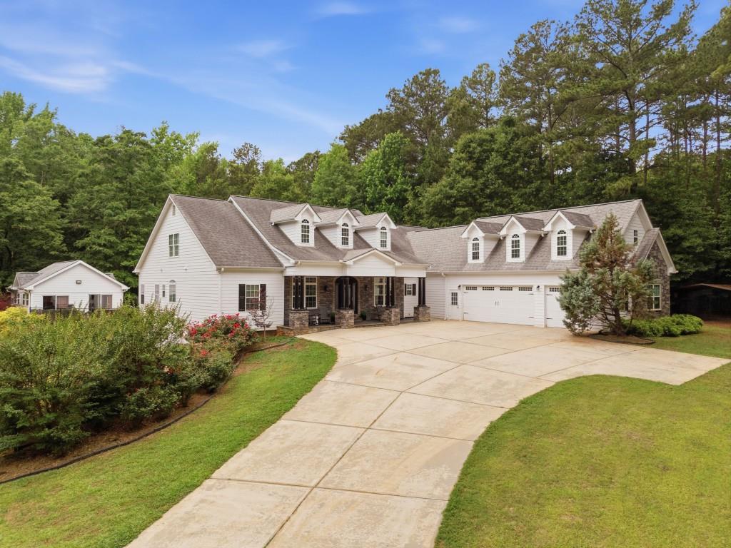 582 Knox Chapel Road Social Circle, GA 30025 - Photo 1 of 49 a front view of a house with garden