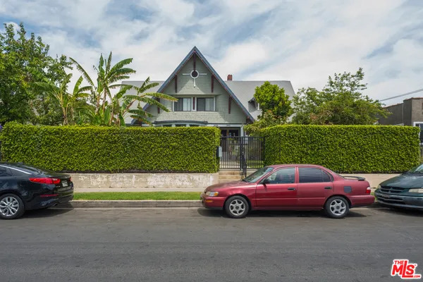 a view of a cars parked in front of a house