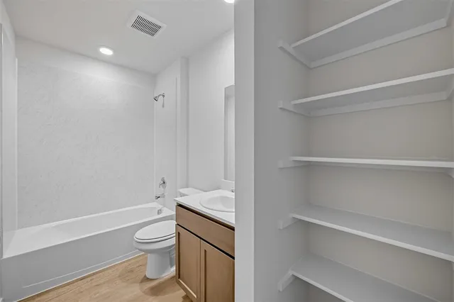 a bathroom with a toilet a sink and bathtub