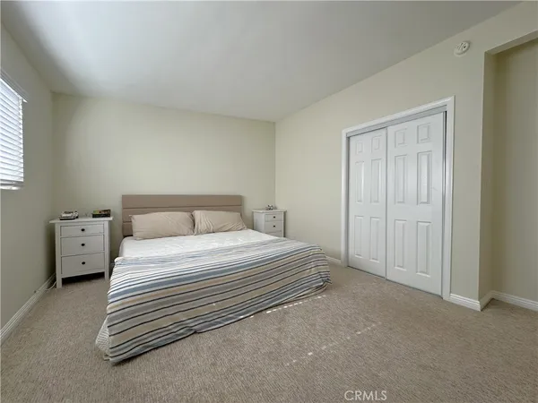 a bedroom with a bed and a view