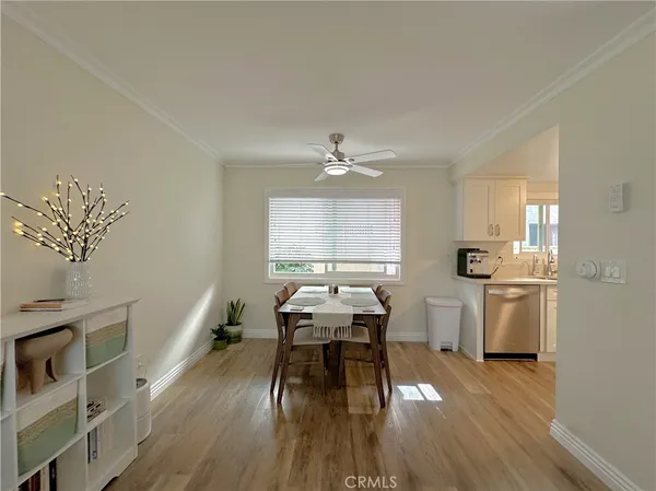 a workspace with furniture window and wooden floor