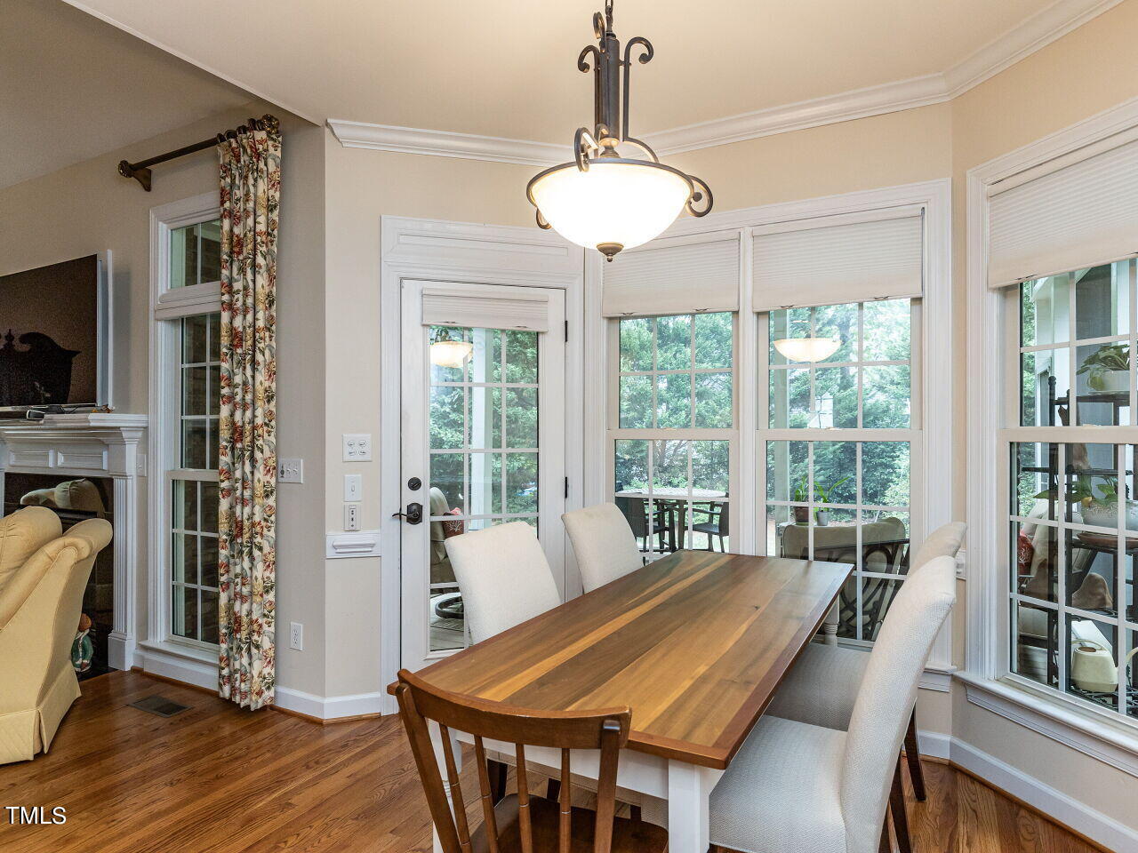 119 Oldefield Lane Garner, NC 27529 - Photo 12 of 38 a view of a dining room with furniture window and wooden floor