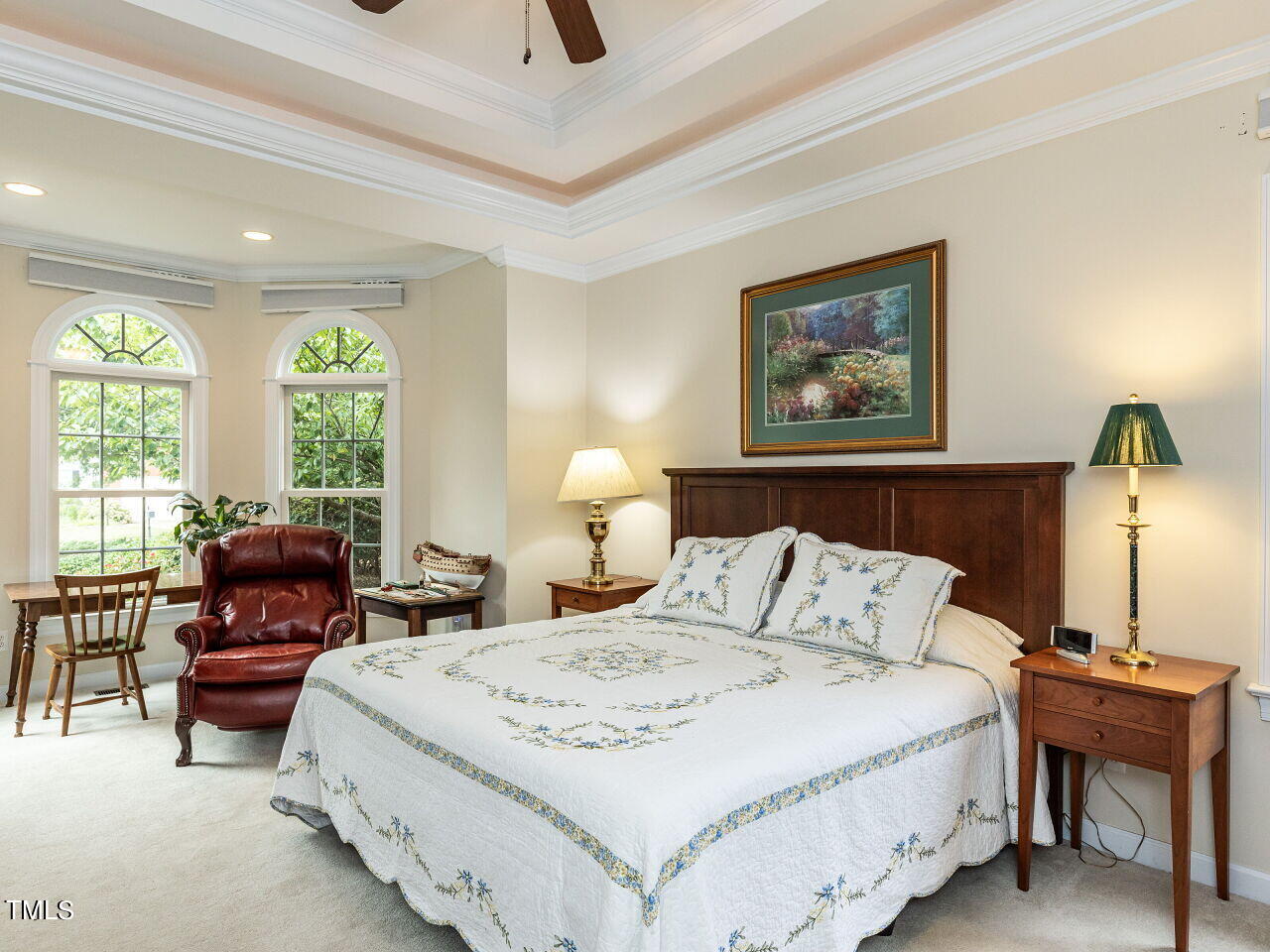 119 Oldefield Lane Garner, NC 27529 - Photo 15 of 38 a bedroom with a bed and a chandelier