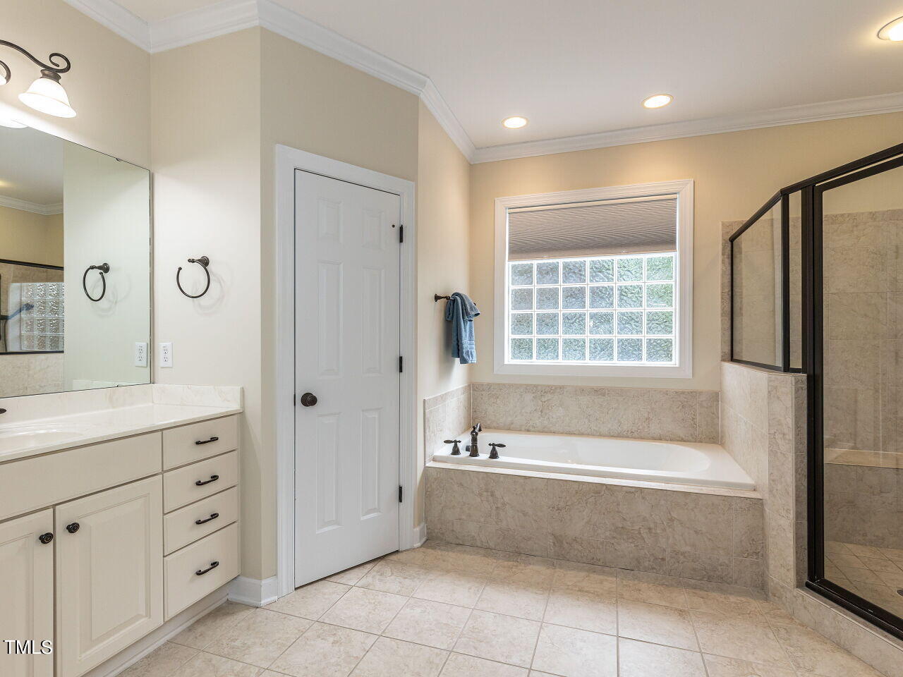 119 Oldefield Lane Garner, NC 27529 - Photo 17 of 38 a spacious bathroom with a granite countertop tub shower and mirror