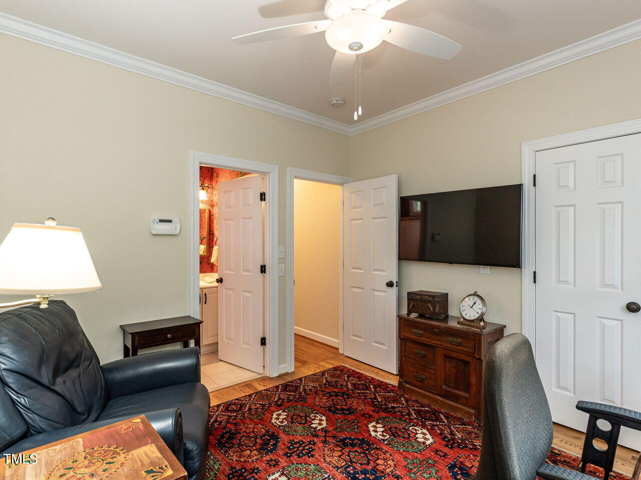 119 Oldefield Lane Garner, NC 27529 - Photo 21 of 38 a living room with furniture and a flat screen tv