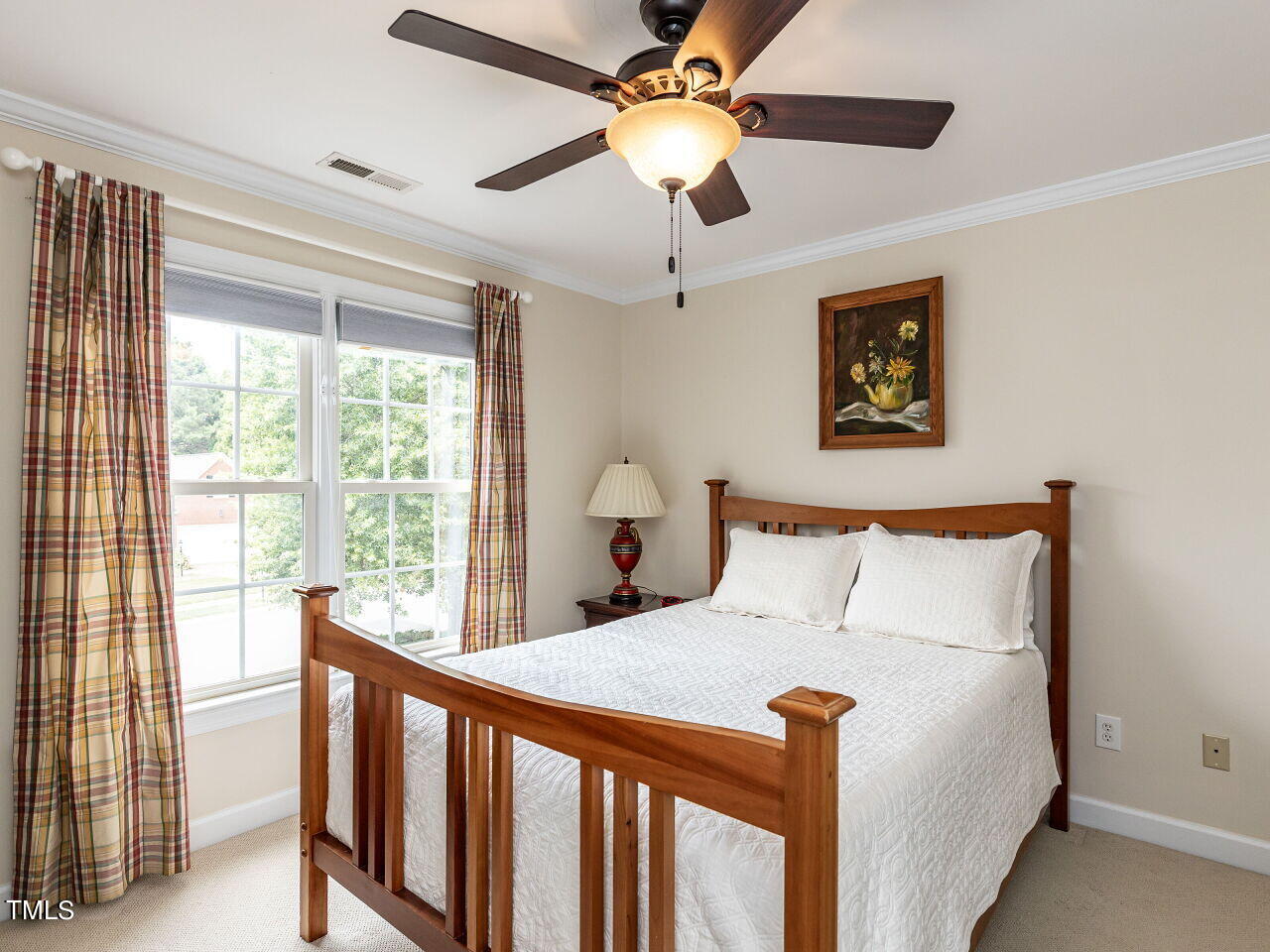 119 Oldefield Lane Garner, NC 27529 - Photo 24 of 38 a bed sitting in a bedroom next to a window