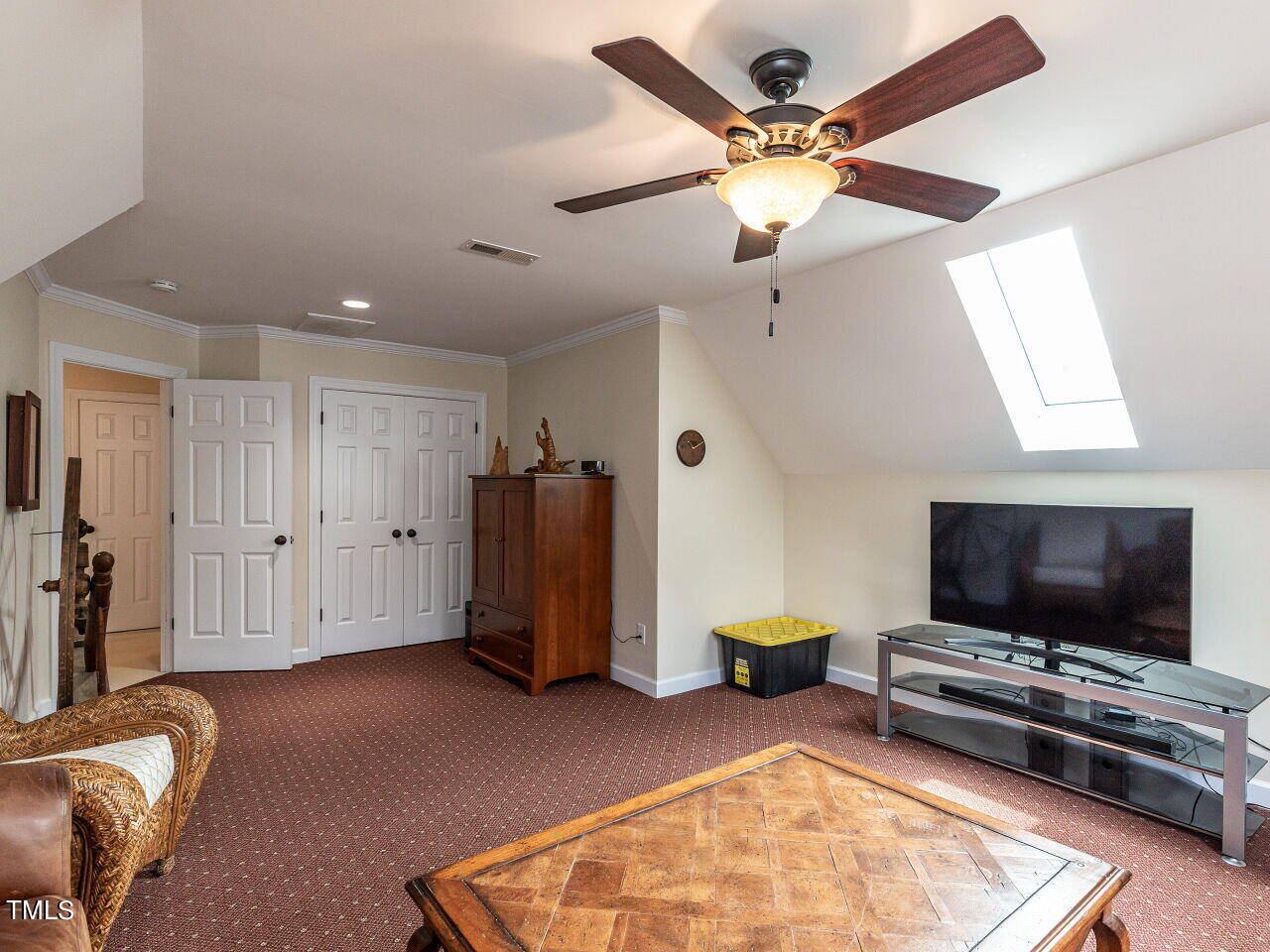119 Oldefield Lane Garner, NC 27529 - Photo 27 of 38 a living room with furniture and a flat screen tv