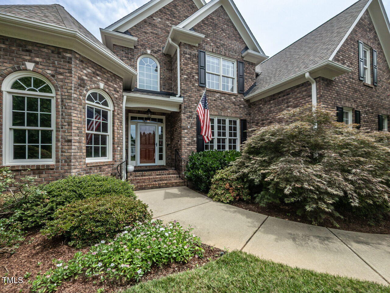 119 Oldefield Lane Garner, NC 27529 - Photo 3 of 38 front view of a brick house with a yard