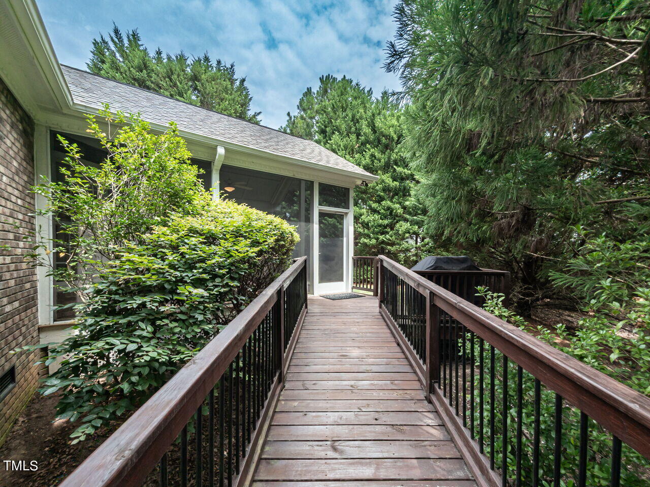 119 Oldefield Lane Garner, NC 27529 - Photo 35 of 38 a view of a house with balcony and wooden floor