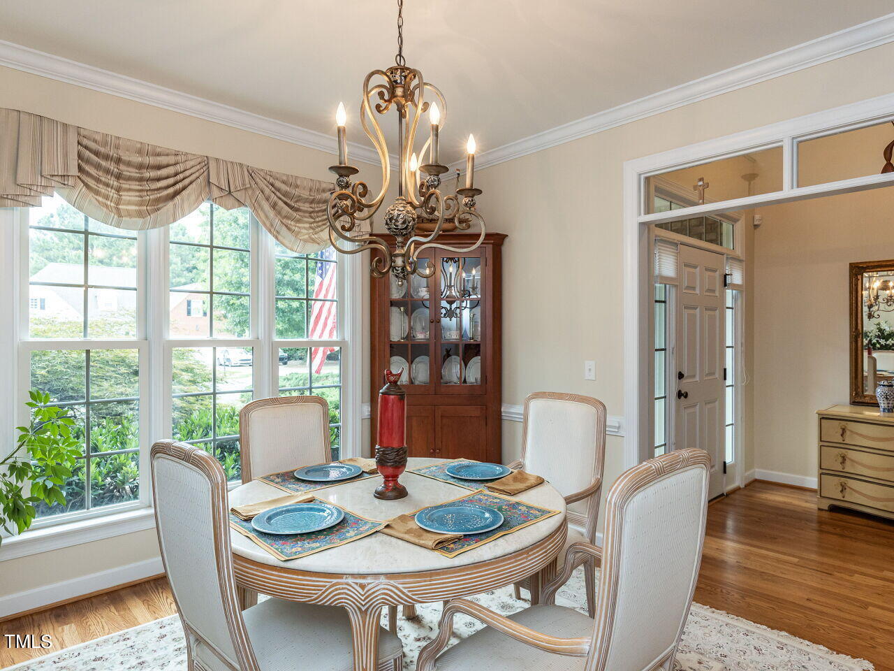119 Oldefield Lane Garner, NC 27529 - Photo 6 of 38 a view of a dining room with furniture window and wooden floor