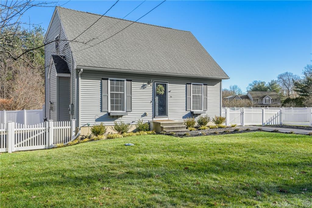 46 Pond Road Windsor, CT 06095 - Photo 1 of 1 a garden with trees in front of it