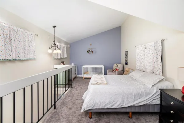 a bedroom with a bed and a book shelf