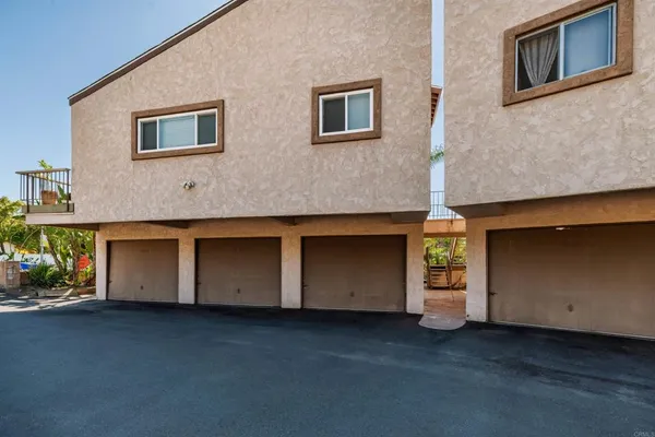 a front view of a house with a yard and fountain