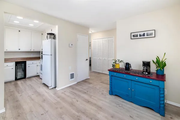 a kitchen with a white cabinets and white appliances