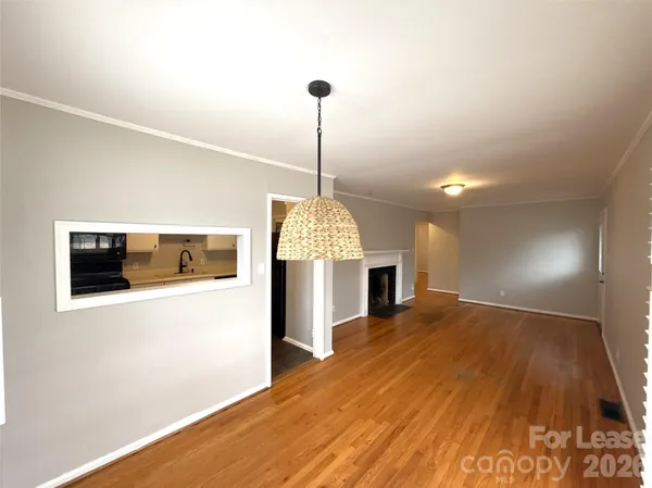 a view of a room with window kitchen and flat screen tv