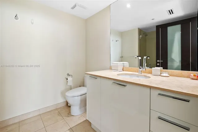 a spacious bathroom with a tub and shower