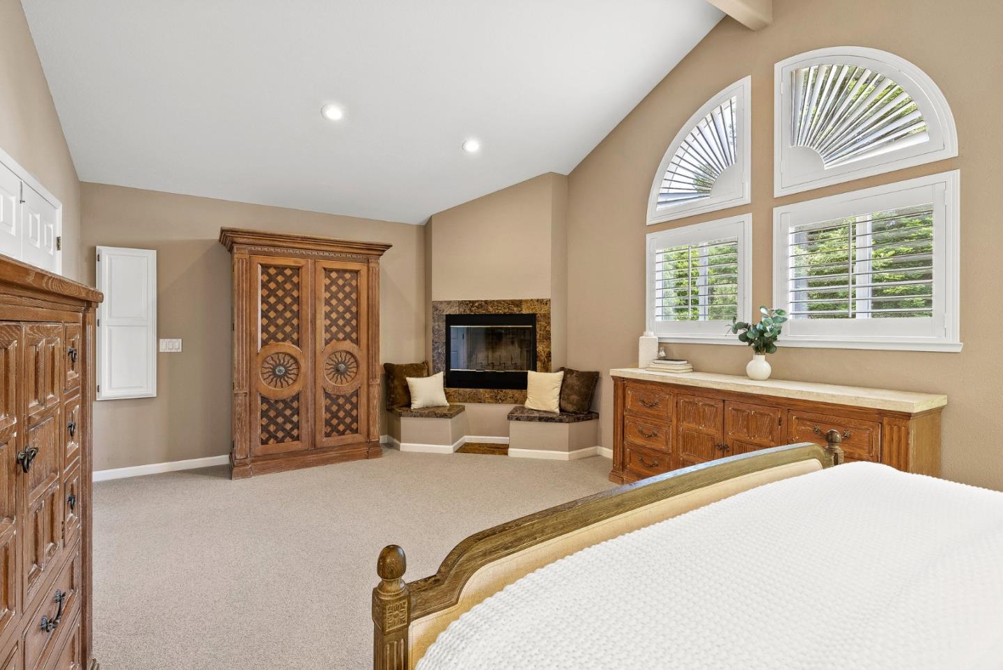 125 Chase Lane Aptos, CA 95003 - Photo 12 of 34 a bedroom with furniture a fireplace and a large window