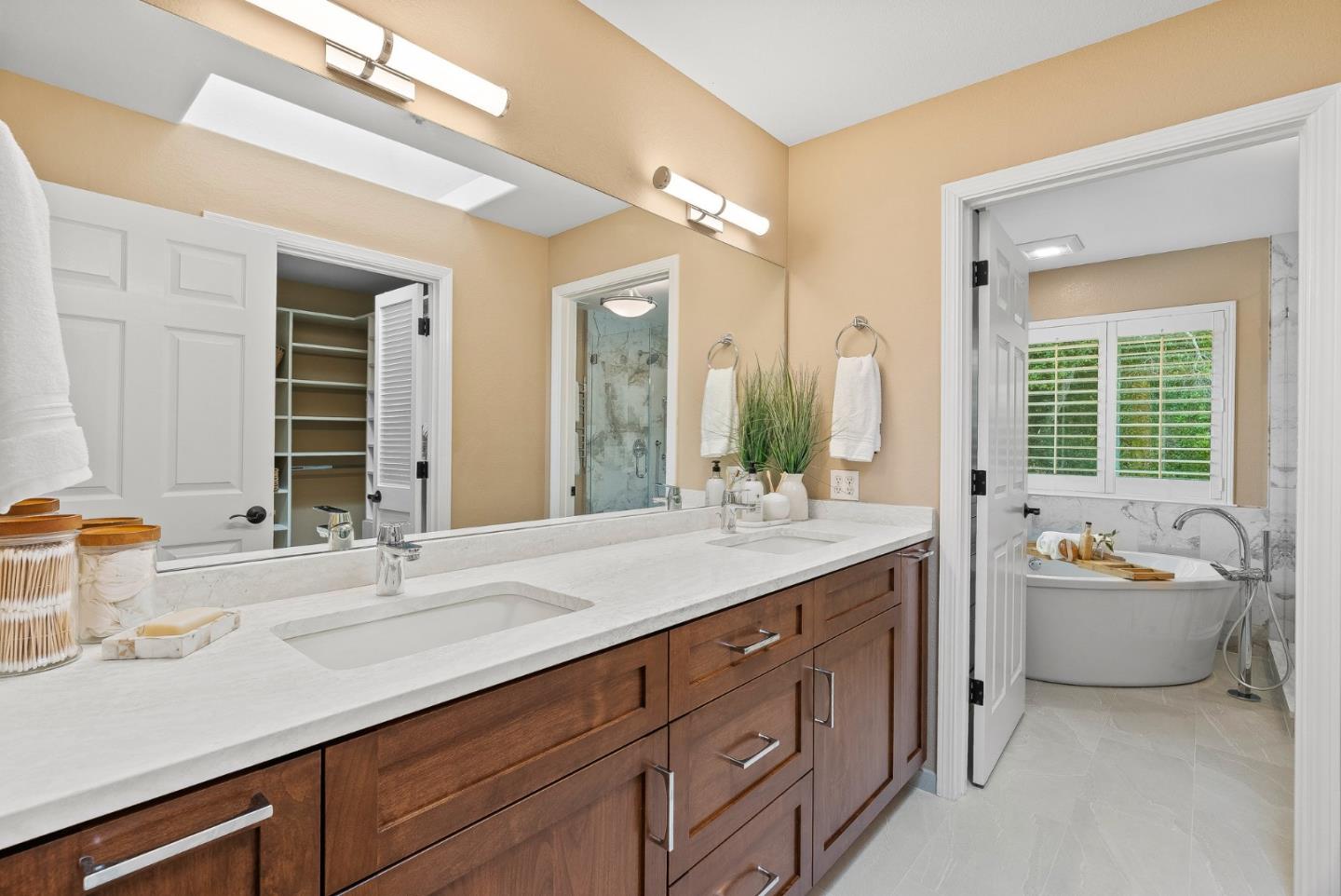 125 Chase Lane Aptos, CA 95003 - Photo 14 of 34 a bathroom with a tub double vanity sink and mirror