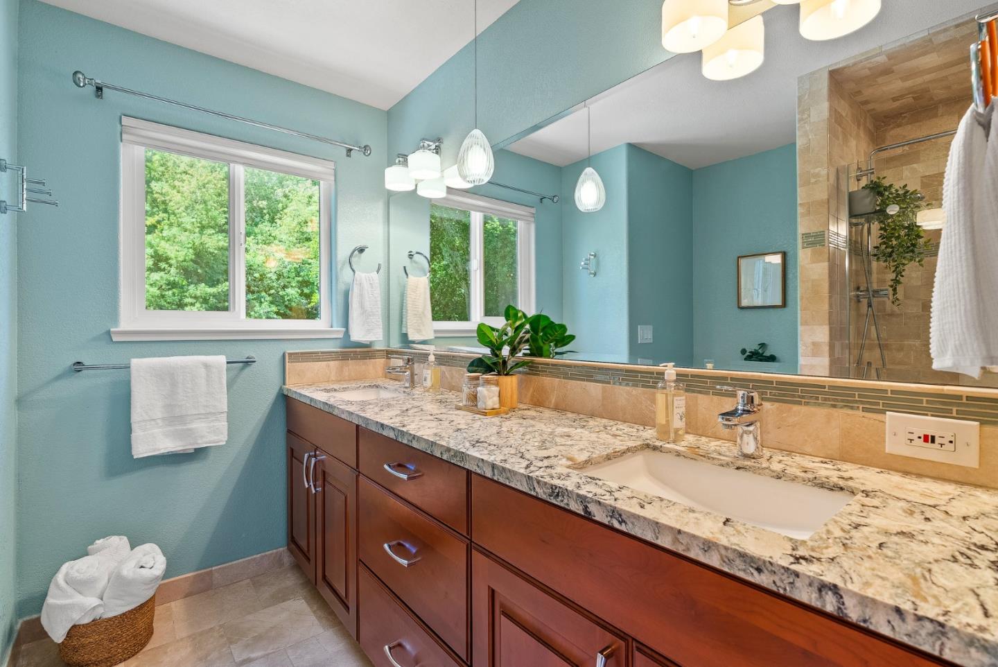 125 Chase Lane Aptos, CA 95003 - Photo 18 of 34 a bathroom with a granite countertop sink and a large mirror
