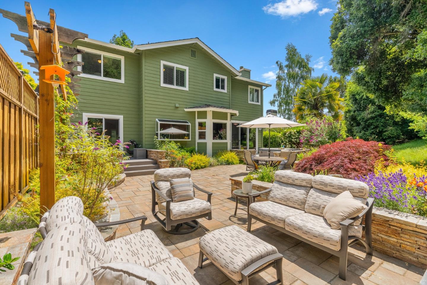 125 Chase Lane Aptos, CA 95003 - Photo 22 of 34 a view of a patio with couches table and chairs and potted plants