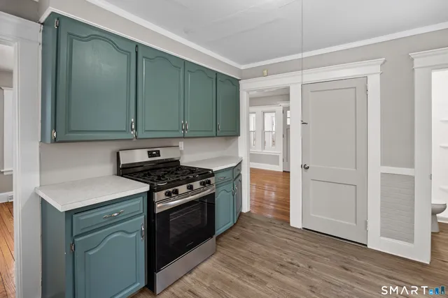 a kitchen with a stove and a refrigerator
