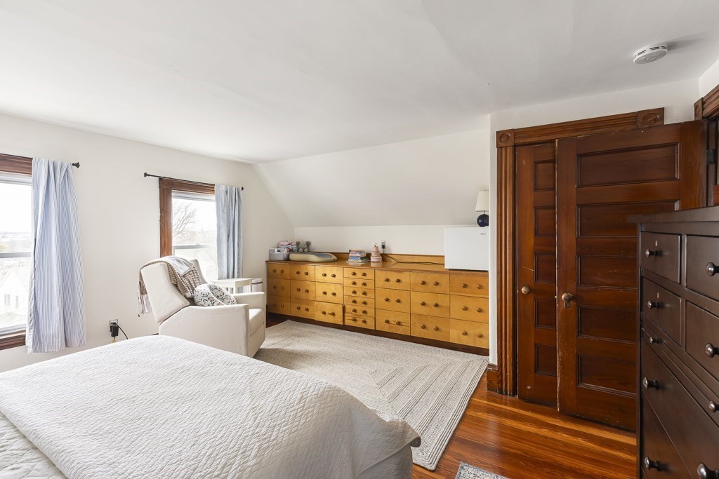 55 Main Street Somerville, MA 02145 - Photo 27 of 28 a bedroom with a bed and a window