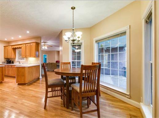 7768 Webster Road White House, TN 37188 - Photo 12 of 30 a view of a dining room with furniture and wooden floor