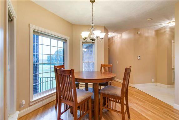 7768 Webster Road White House, TN 37188 - Photo 13 of 30 a dining room with furniture a chandelier and wooden floor