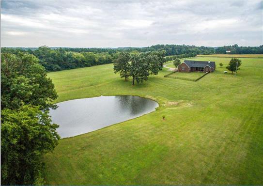 7768 Webster Road White House, TN 37188 - Photo 26 of 30 a view of a lake with a yard