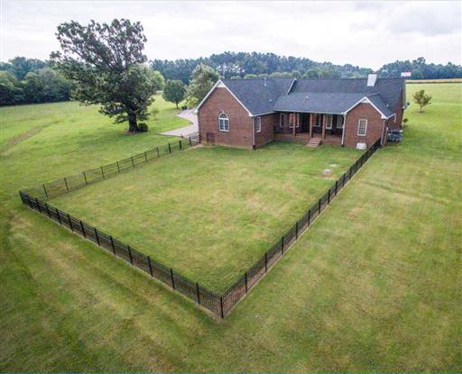 7768 Webster Road White House, TN 37188 - Photo 27 of 30 a view of a big house with a big yard and large trees