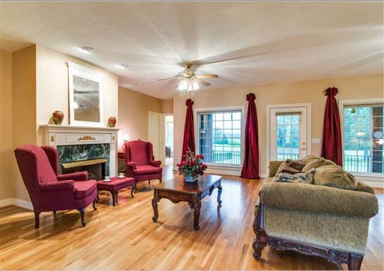 7768 Webster Road White House, TN 37188 - Photo 5 of 30 a living room with furniture a fireplace and a large window
