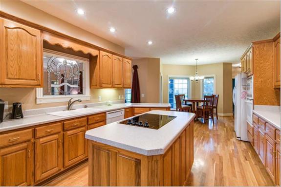 7768 Webster Road White House, TN 37188 - Photo 10 of 30 a kitchen that has a sink a table and chairs in it
