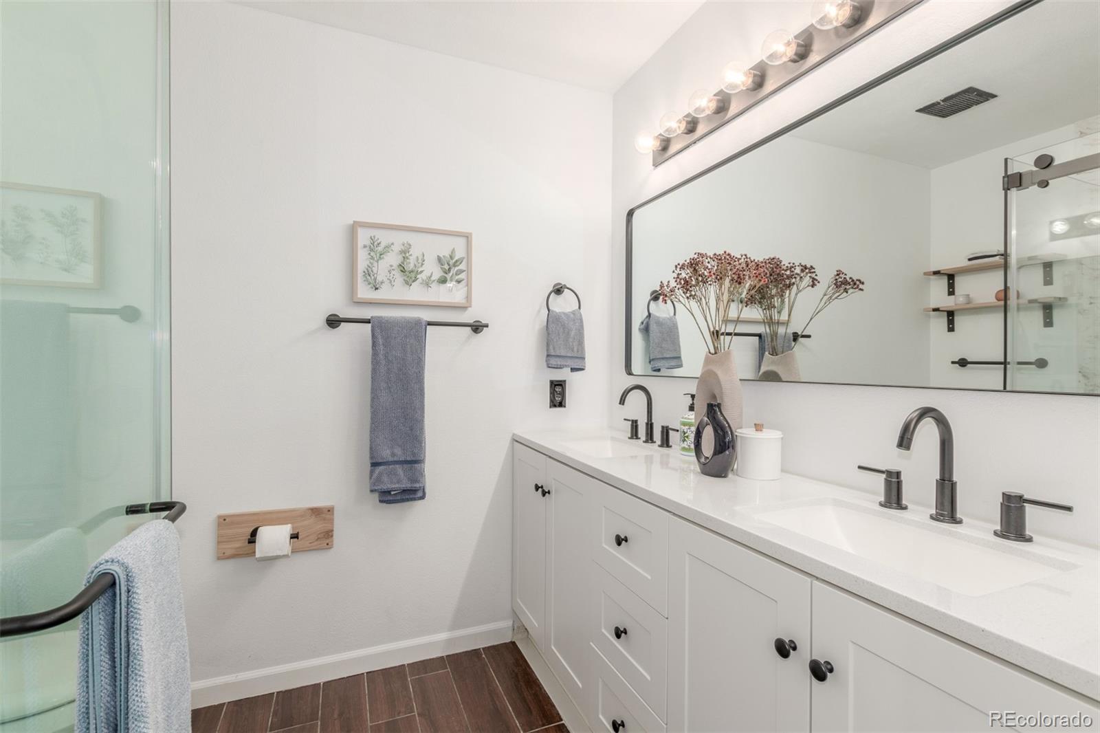 4864 Parsons Way Castle Rock, CO 80104 - Photo 17 of 50 a bathroom with a sink and a mirror